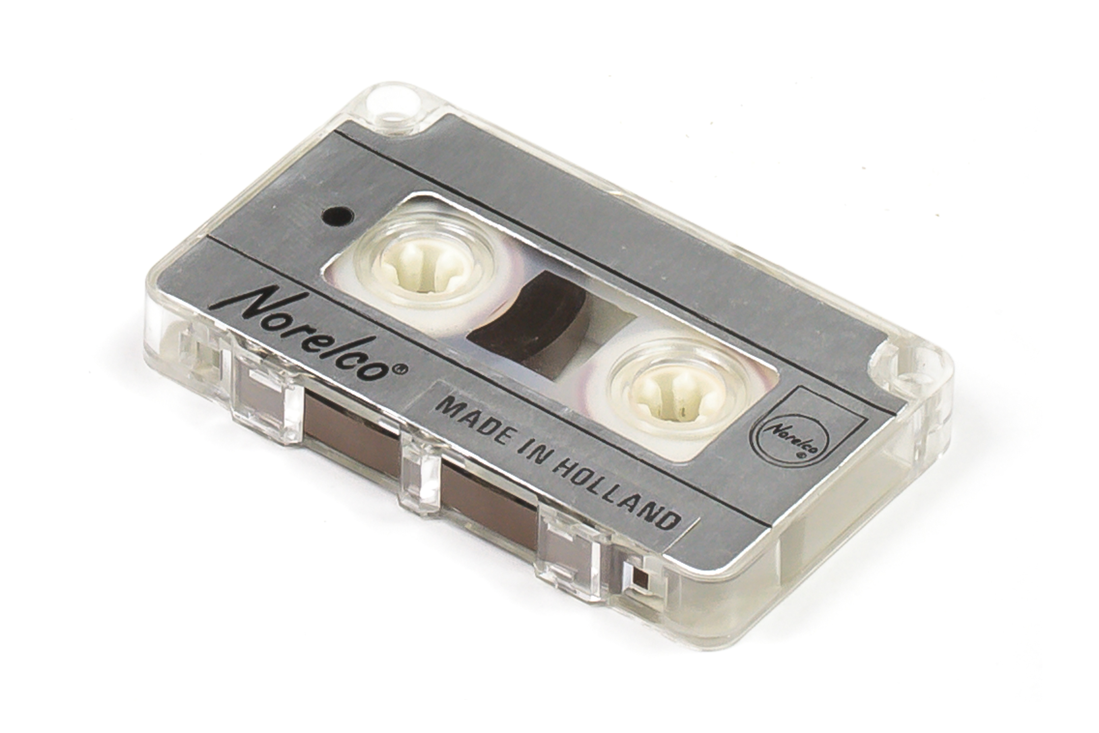 Plastic mini-cassette with silver paper label