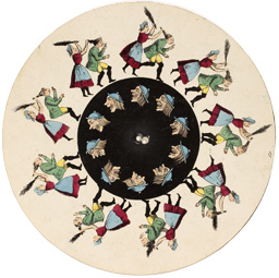 Lithographed and hand colored disc with short animation,attached to handle along with slotted disc, additional discs alongside