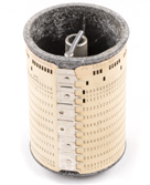 A small metal cylinder with a punch card wrapped around it to control formating for a keypunch machine
